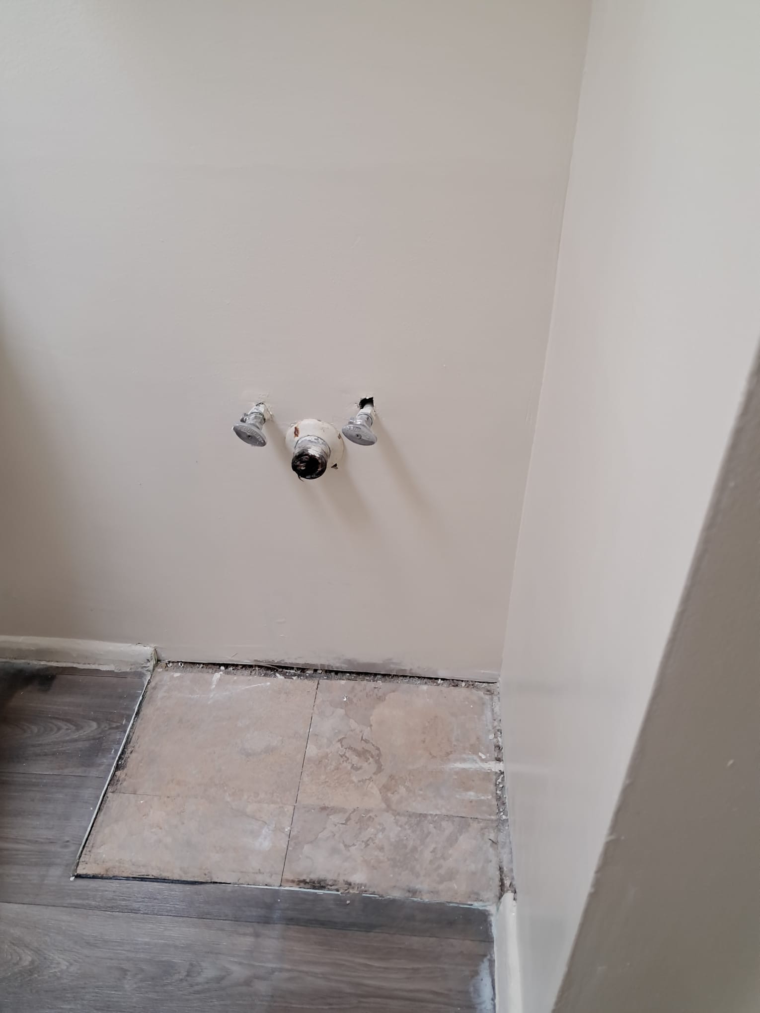 Bathroom vanity wall repaired and painted after drywall work
